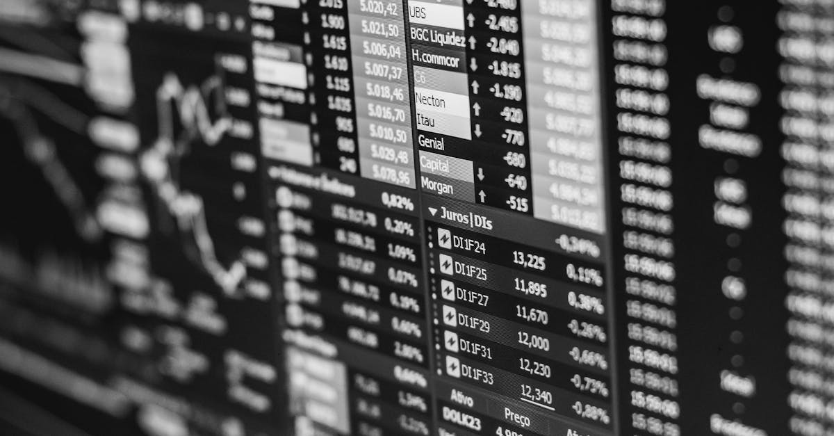 Monochrome image of stock market data on a screen, depicting financial information and trends.