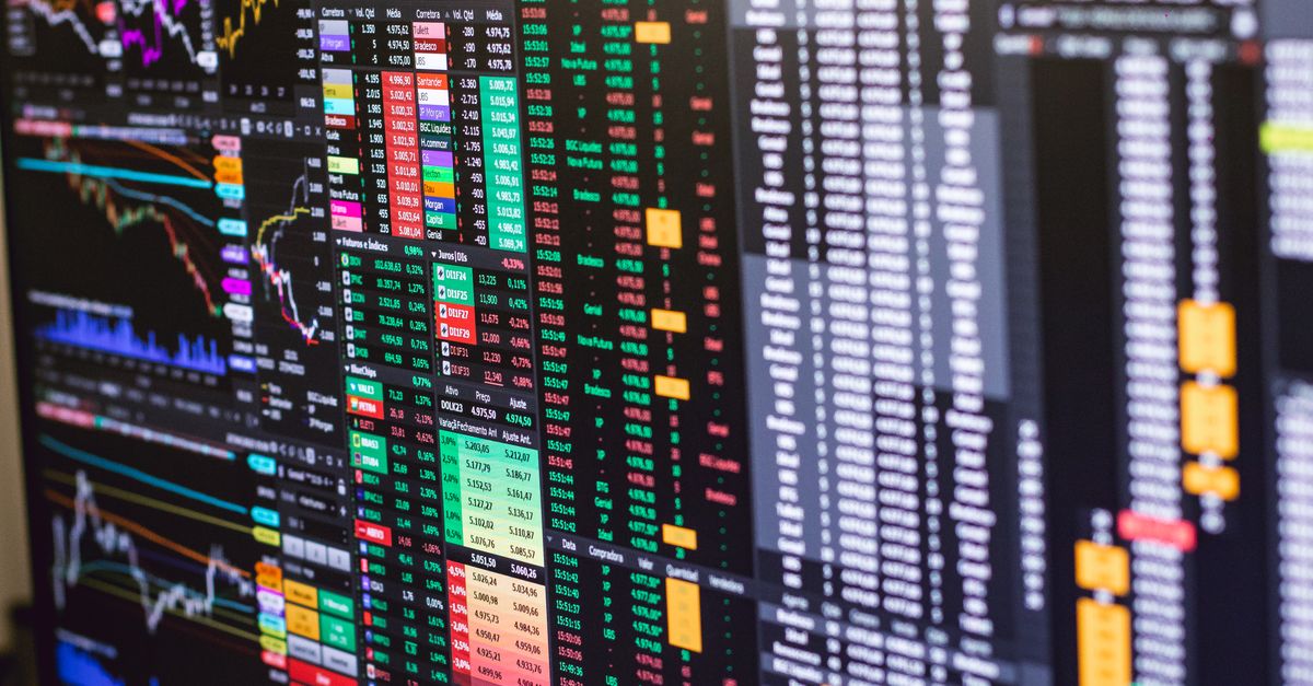 Detailed financial trading screen with colorful charts and data representing market fluctuations.