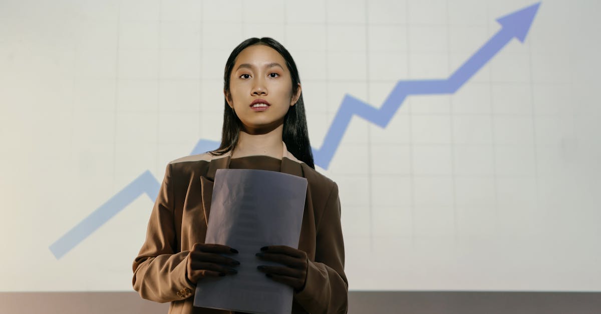 A confident businesswoman presenting a growth chart in a professional setting.