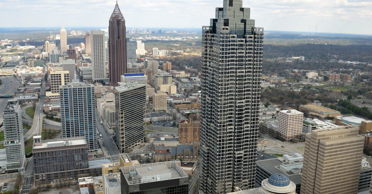 Aerial view of the Atlanta skyline showcasing iconic skyscrapers amidst a vibrant cityscape.