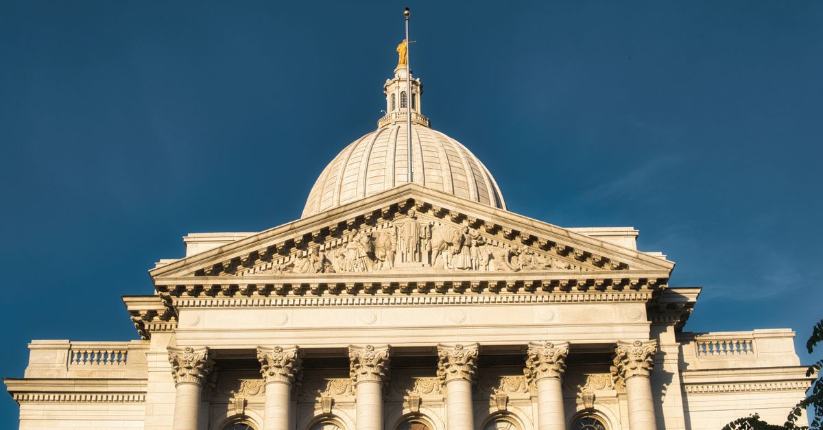 Stunning view of Wisconsin State Capitol building against a clear blue sky in Madison.