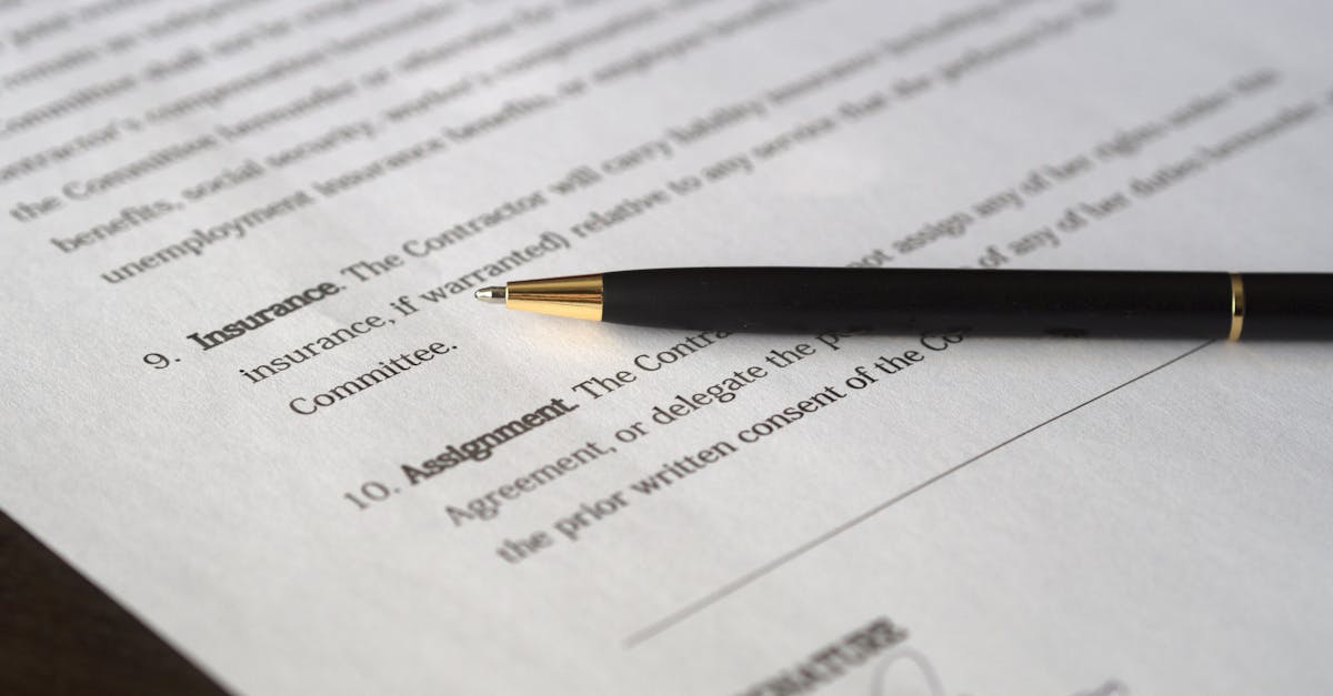 Close-up image of a business contract and pen, signed and ready for agreement.