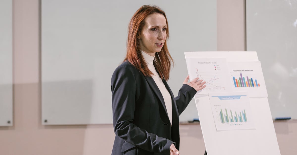Confident businesswoman delivers presentation with charts at a professional conference.