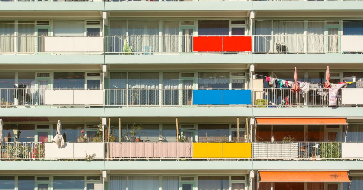 A vibrant display of colorful balconies on a residential building. Perfect for urban lifestyle themes.