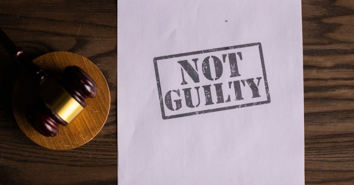 A courtroom document labeled 'Not Guilty' beside a gavel symbolizes justice.