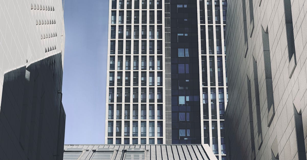 High-rise buildings in Tianjin's bustling city center showcasing modern architecture under a clear sky.