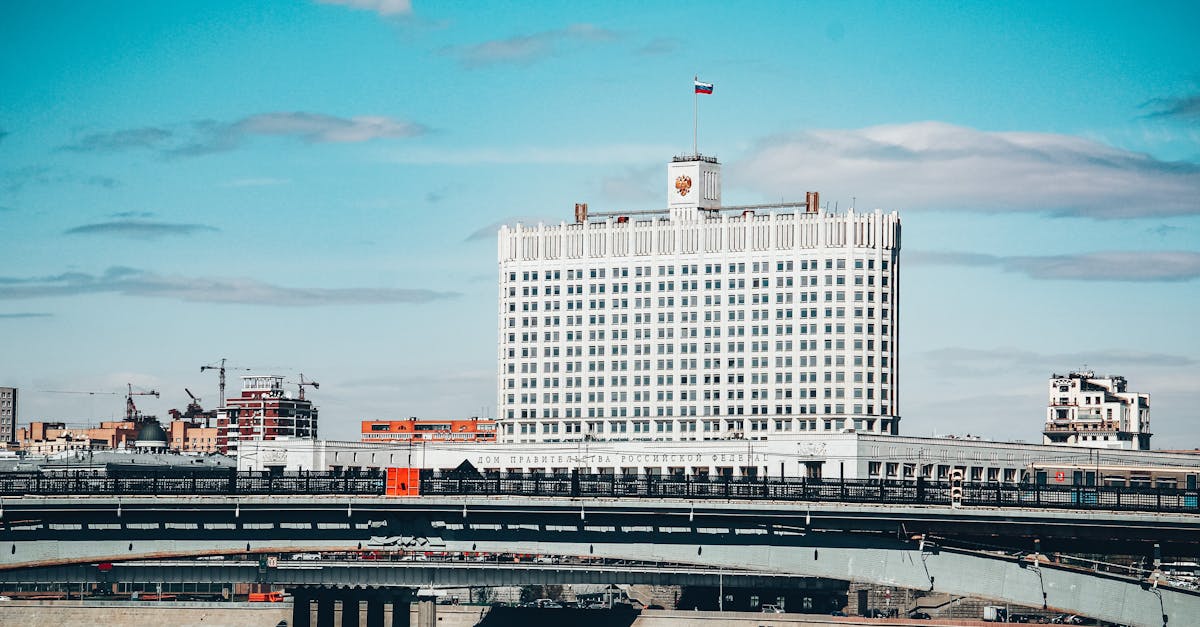 View of the Russian government building and bridge on a clear day in Moscow.