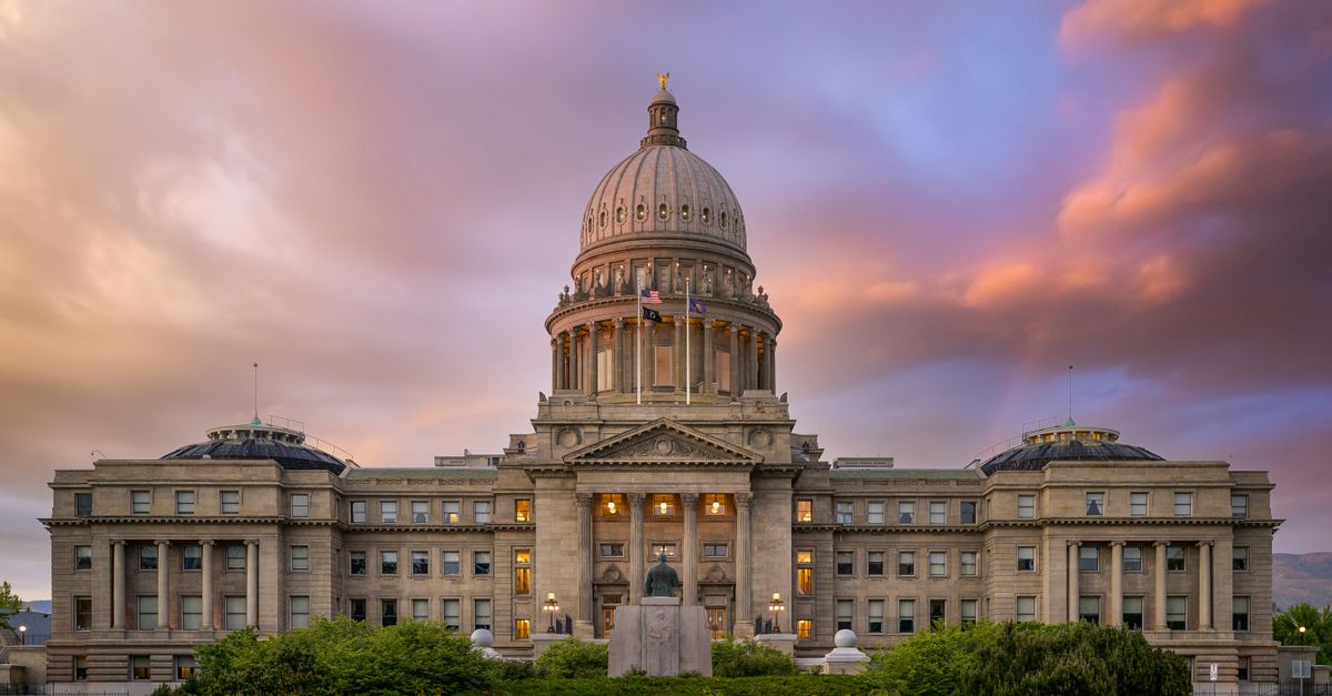 Exterior of famous Idaho State Capitol building located in America under colorful sky at sunrise