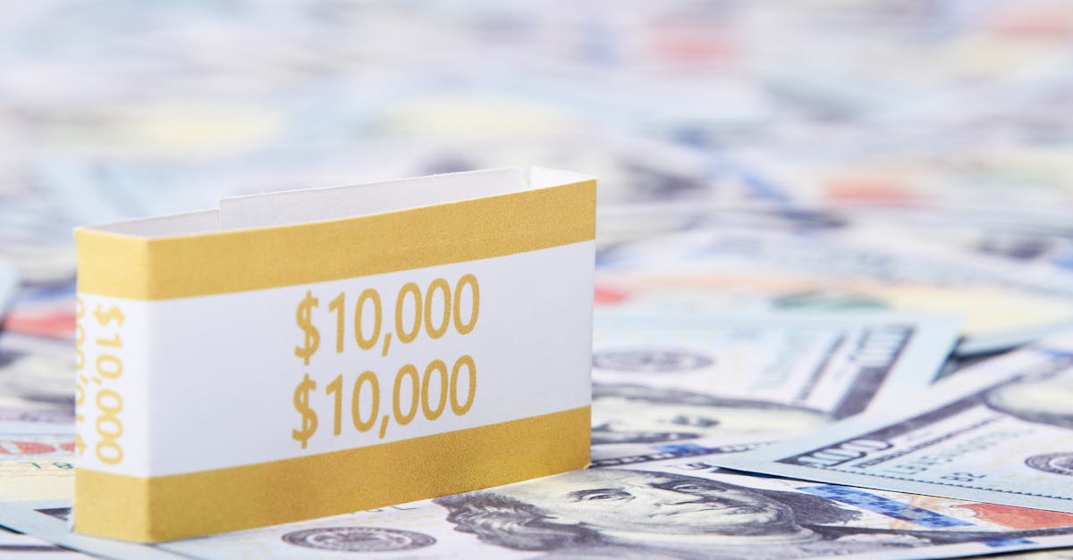 Close-up of a stack of $10,000 US dollar bills with a currency strap on a background of paper money.