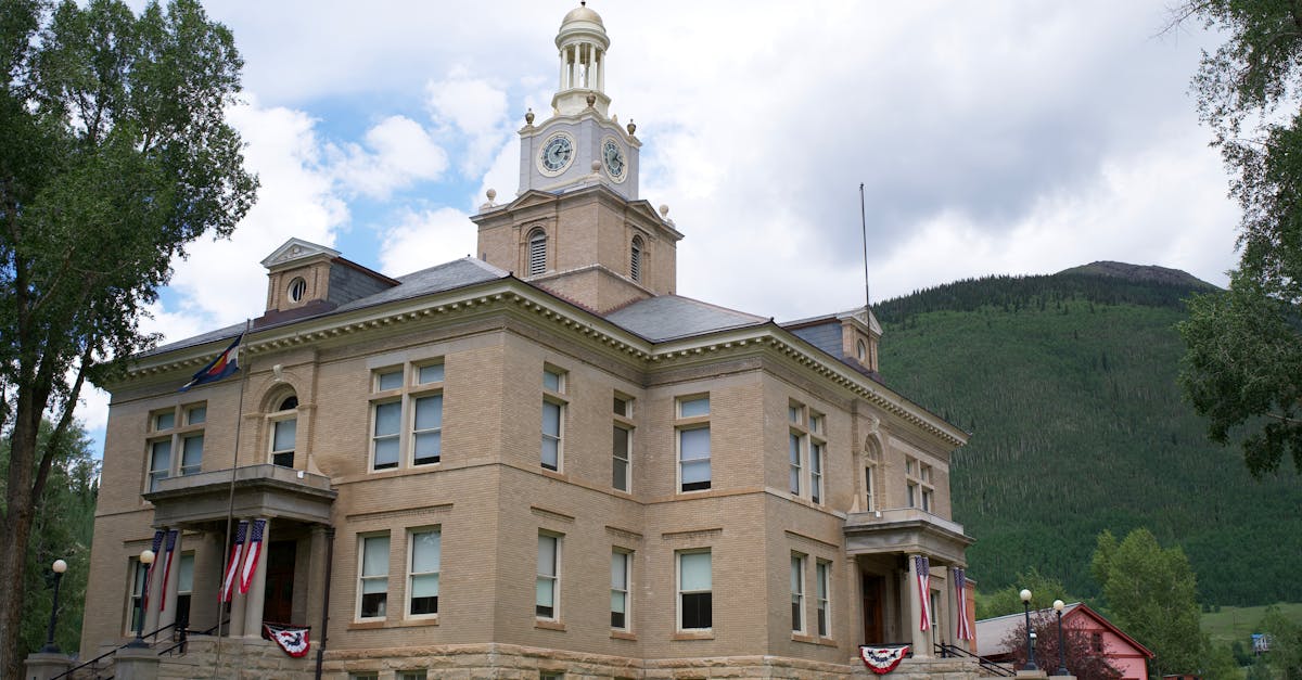 The classic architecture of San Juan County Courthouse in Silverton, Colorado, nestled in a mountain town setting.
