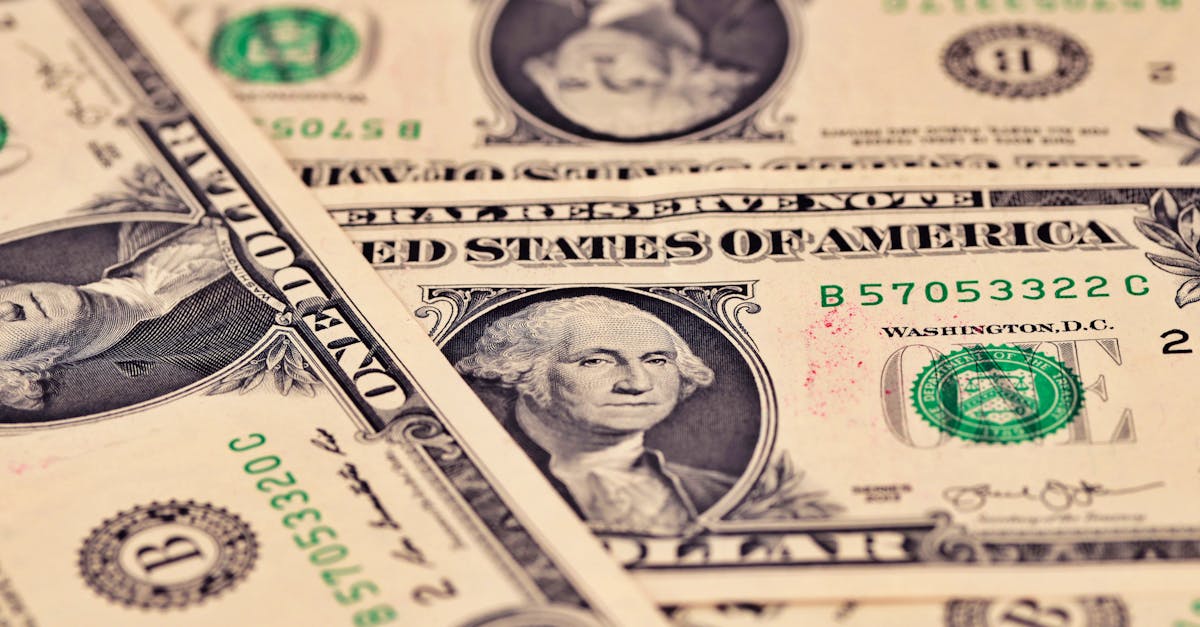 Detailed close-up of US one dollar bills showcasing intricate design and texture.